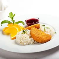Breaded camembert cheese with rice and cranberry jam