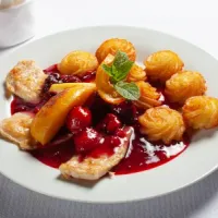 Grilled chicken breast with forest fruit sauce